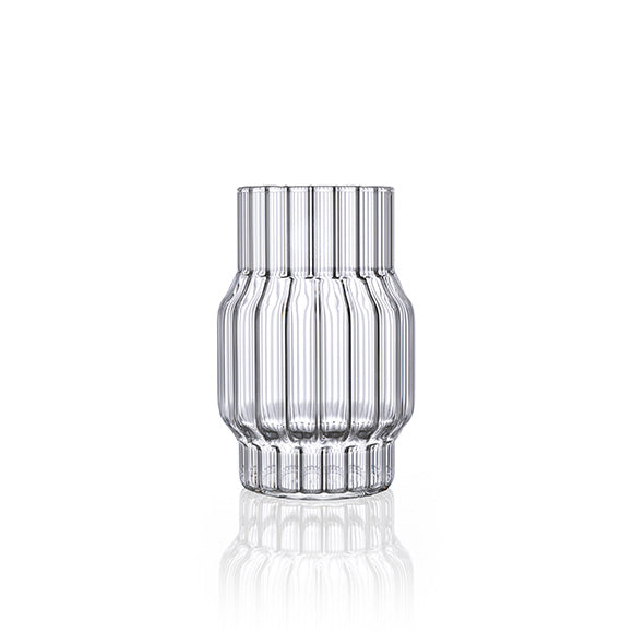 Small vase in fluted glass to hold flowers for home decor.
