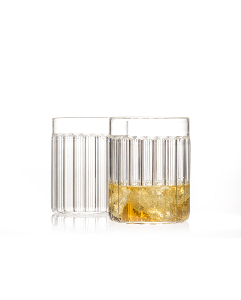 Two fluted tumbler glasses designed by Felicia Ferrone.