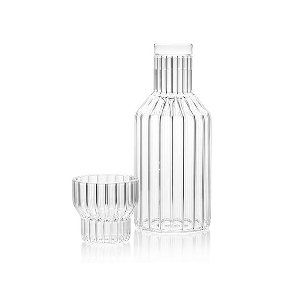 Designer bedside carafe and small glass, both in fluted glass designed by Felicia Ferrone.