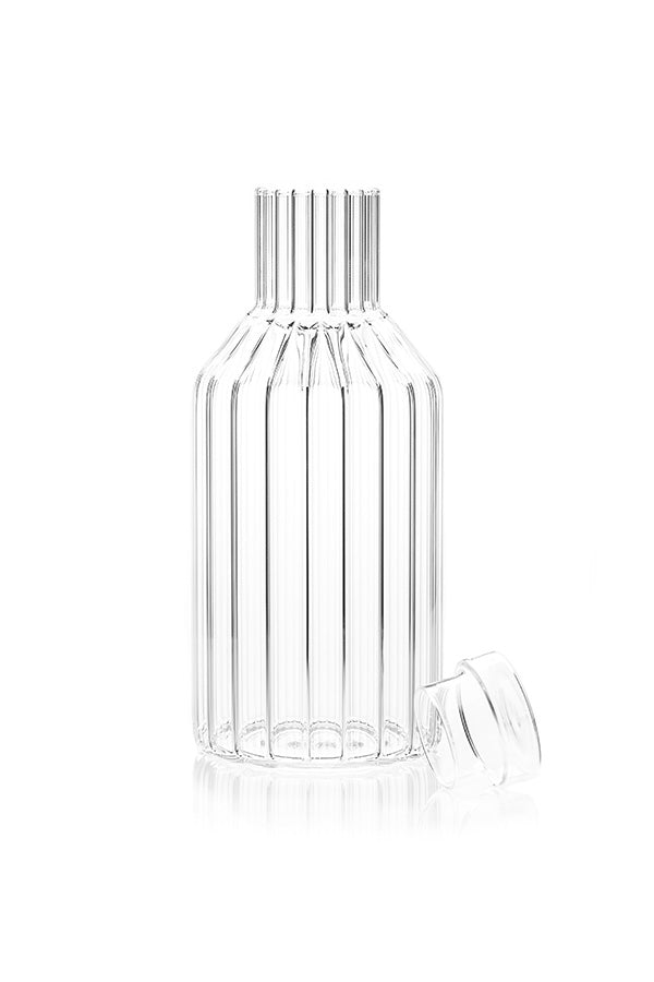 Modern, designer carafe in fluted glass with lid off. 