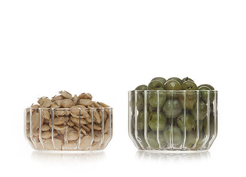 Designer glass bowl in fluted glass filled with nuts and olives by Felicia Ferrone. 