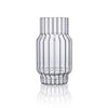 Clear, fluted vase in glass for flowers in home decor. 