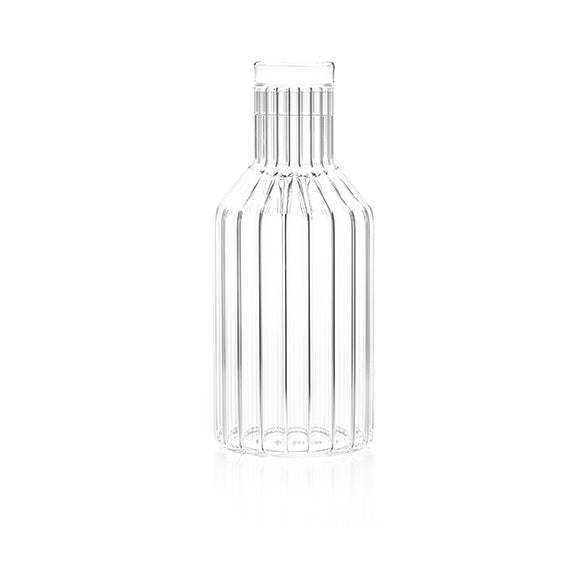 A contemporary designer decanter in fluted glass, handmade by master craftsman