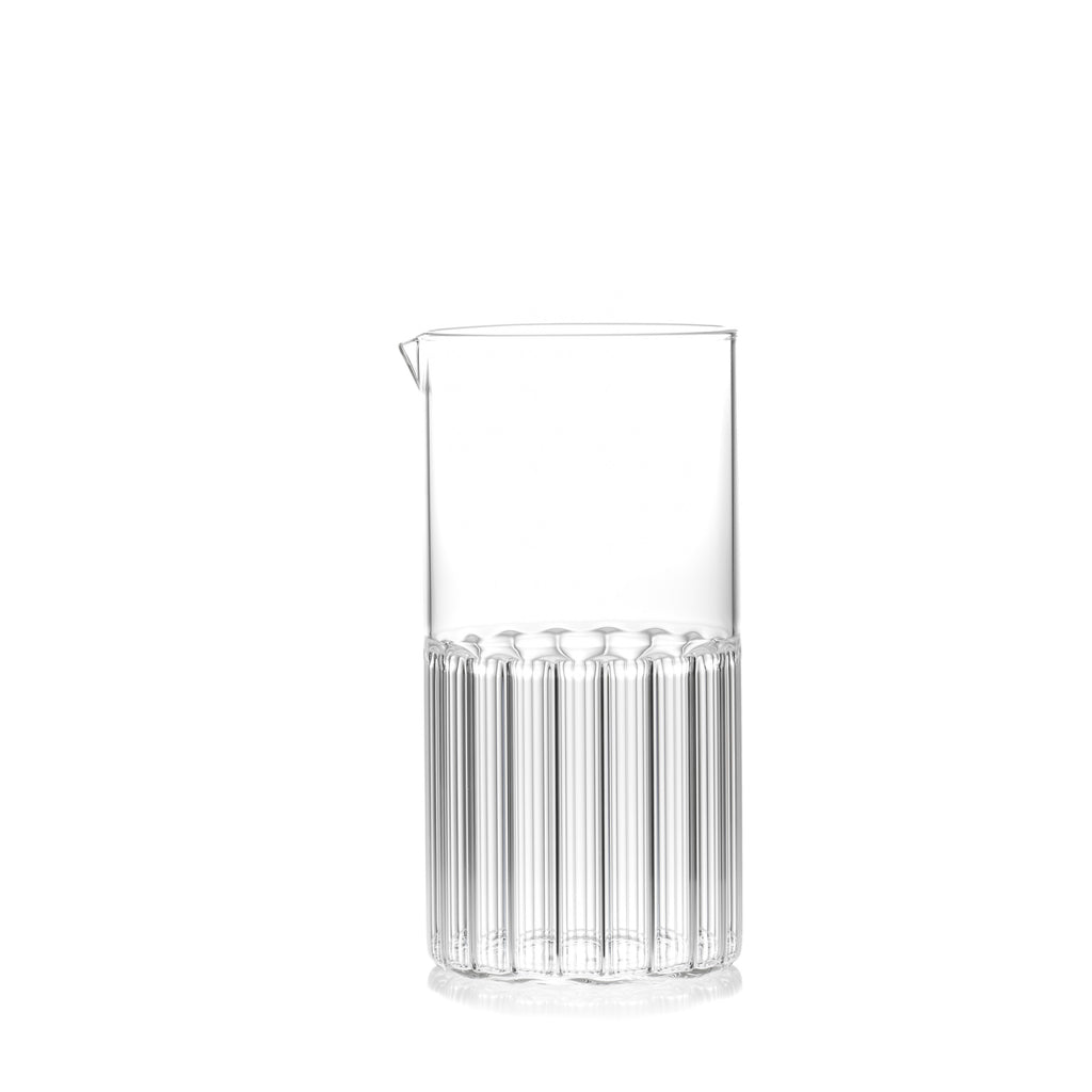 Clear, half fluted and half smooth glass carafe for water, juice or cocktails by designer Felicia Ferrone.