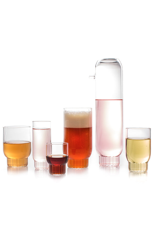 The entire modern Rasori Collection of glassware containing colorful liquids. 