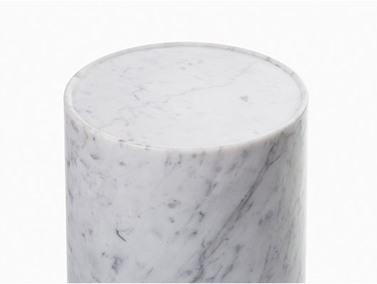 Close up of white and grey marble side table. 