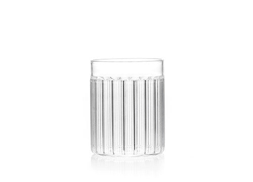 Designer tumbler glass in fluted glass called "Bessho Tumbler" by Felicia Ferrone. 