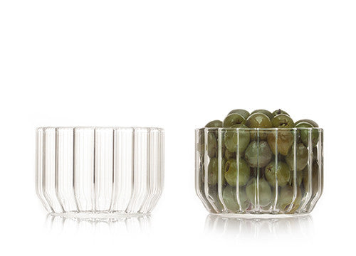 Designer glass bowls in fluted glass and filled with olives by Felicia Ferrone. 