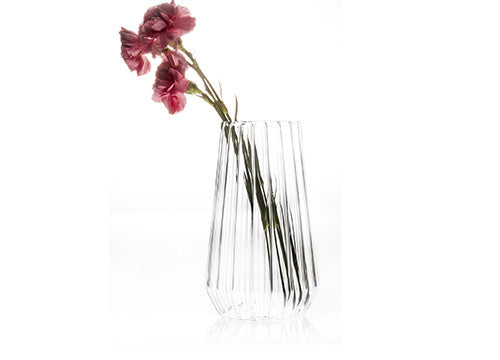 Fluted glass flower vase with carnations by designer Felicia Ferrone.