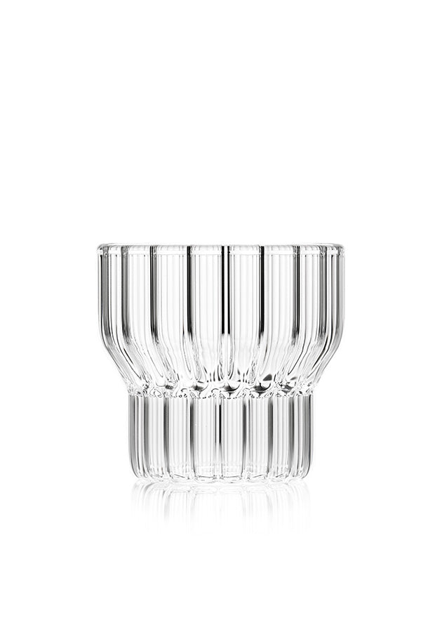A single low, clear, fluted drinking glass by contemporary designer. 